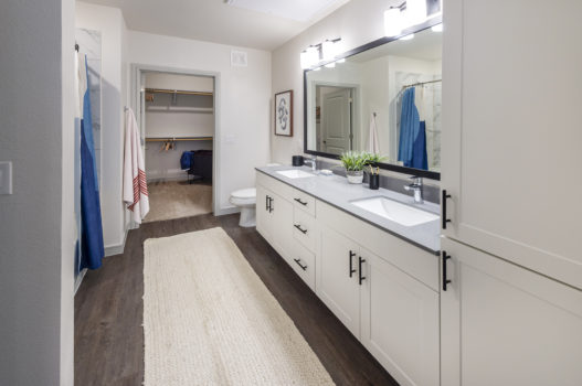 Bathroom with two sinks at The Waterview in Richmond, Texas